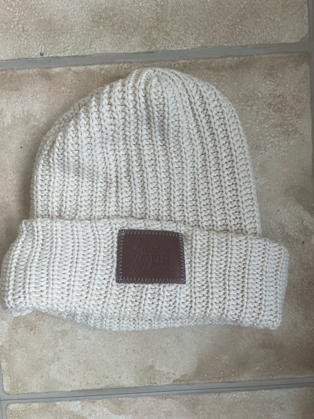 Love Your Melon Cream knit beanie brown leather logo patch; OS